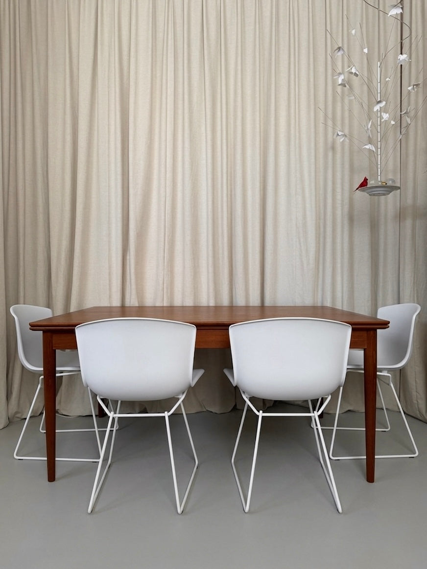 Teak dining table with draw leaf extensions