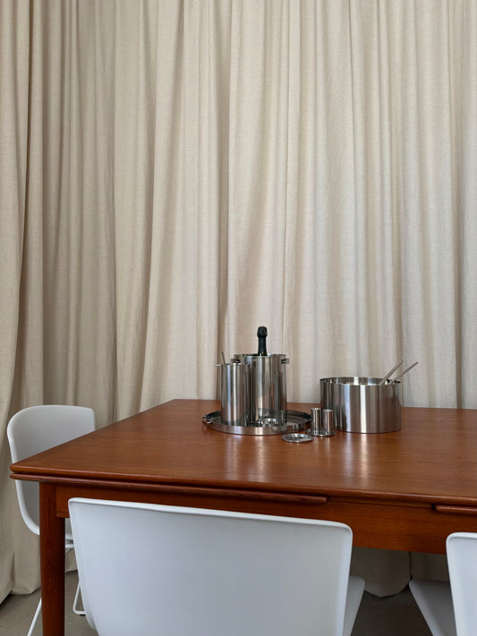 Teak dining table with draw leaf extensions