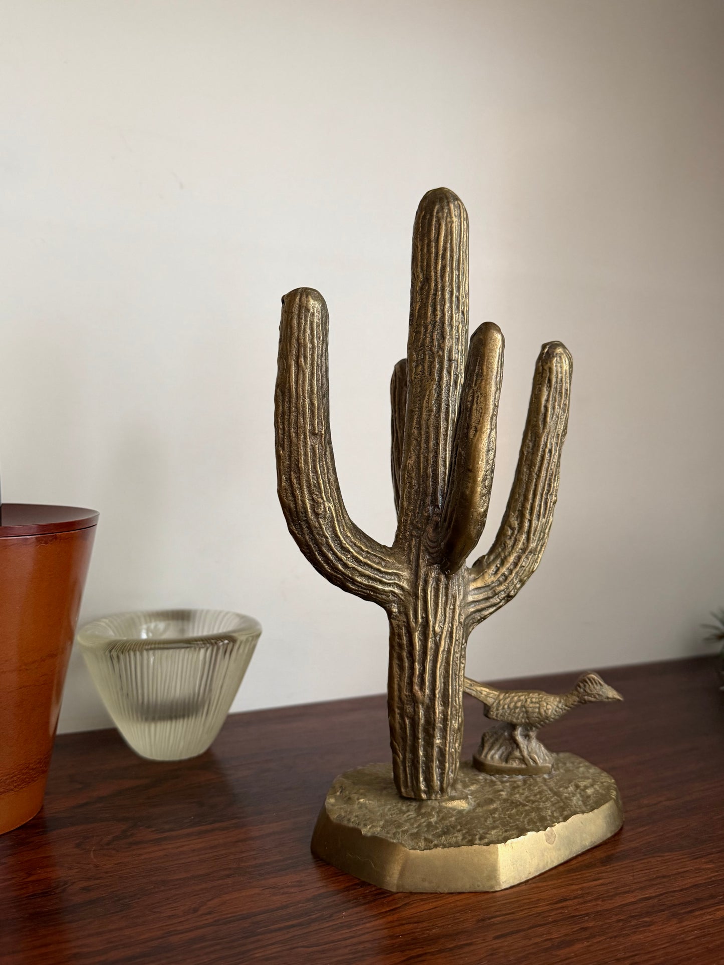 Brass roadrunner and cactus sculpture
