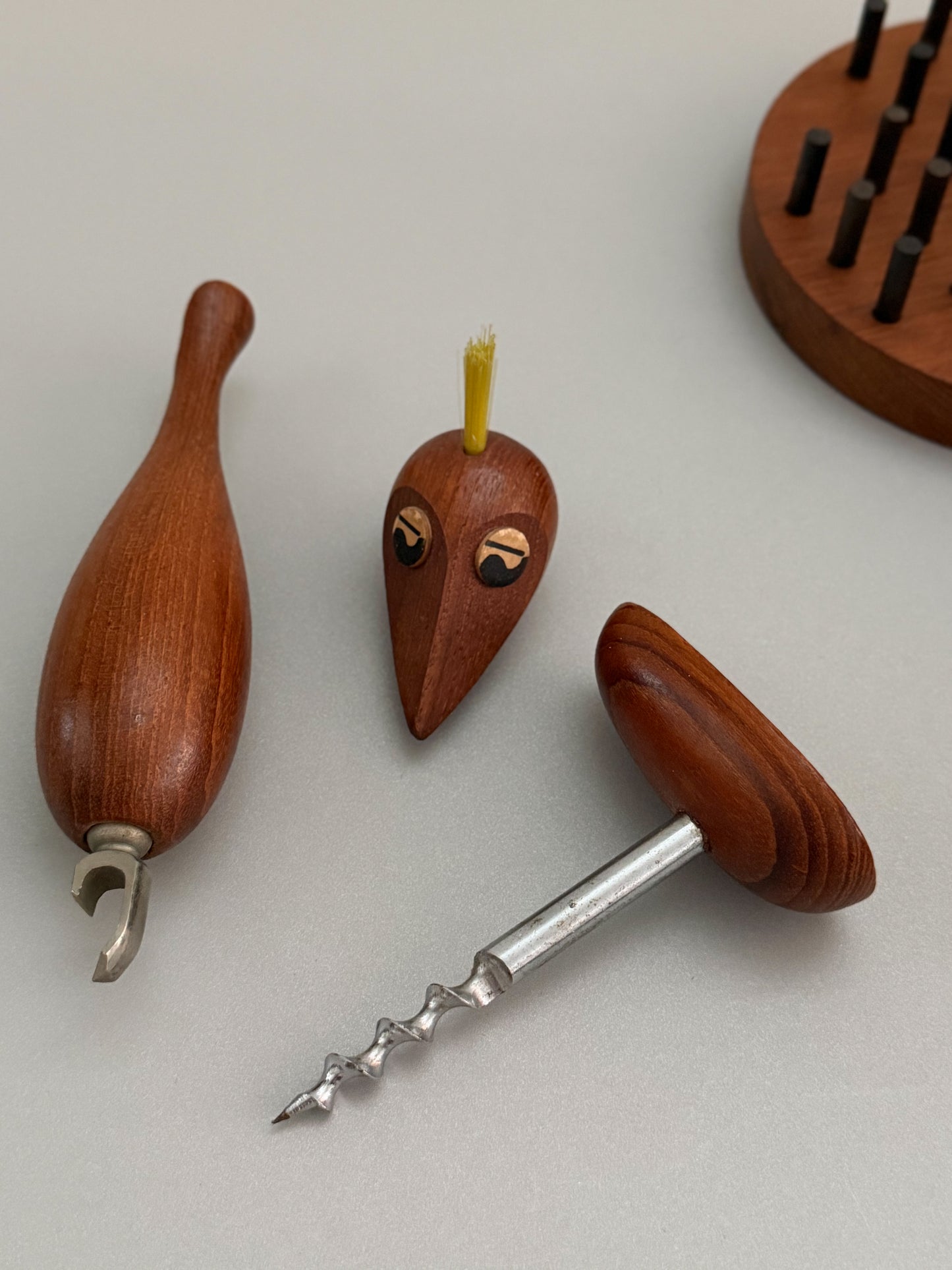 Teak bar tools in shape of a bird
