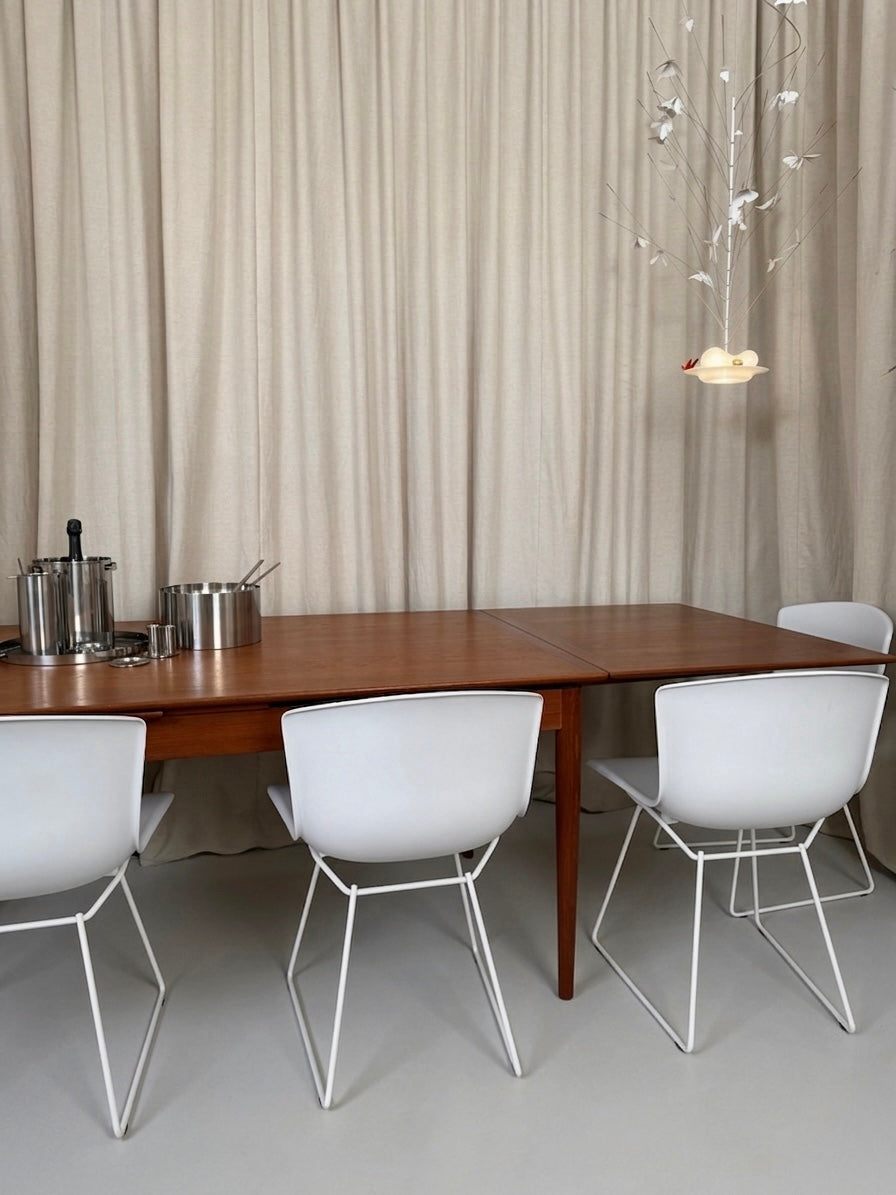 Teak dining table with draw leaf extensions