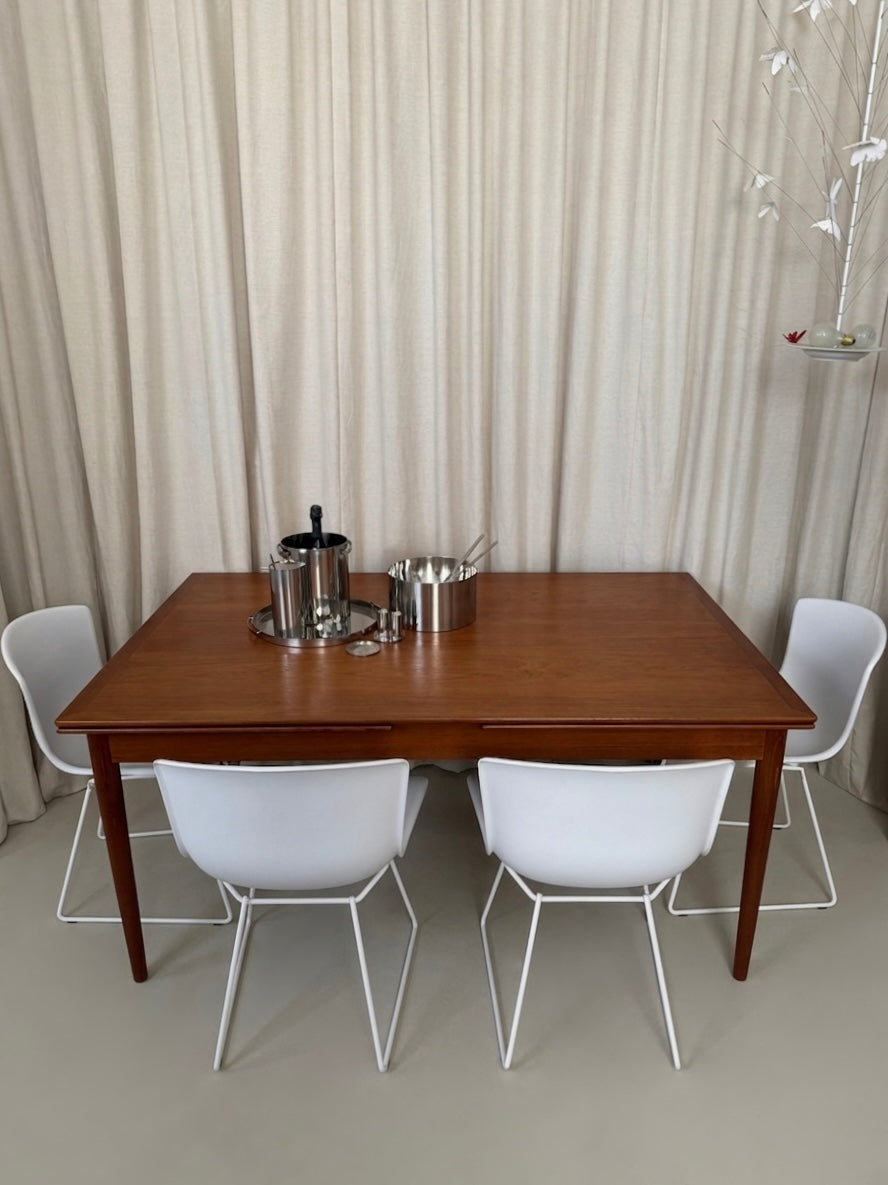 Teak dining table with draw leaf extensions