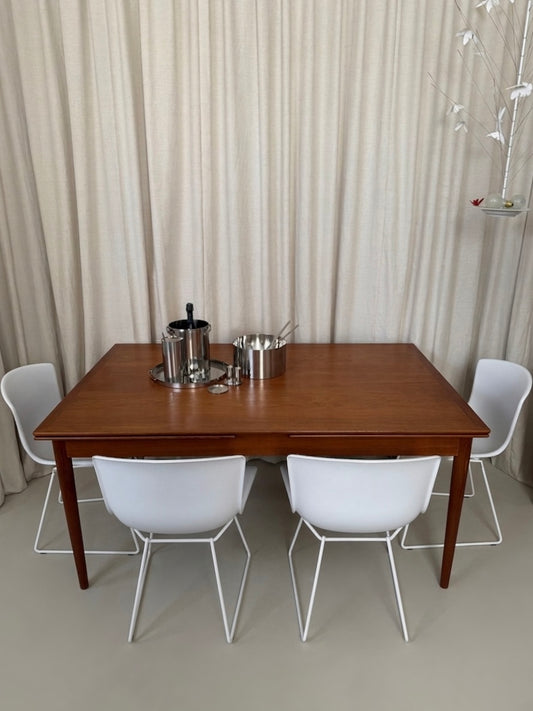 Teak dining table with draw leaf extensions