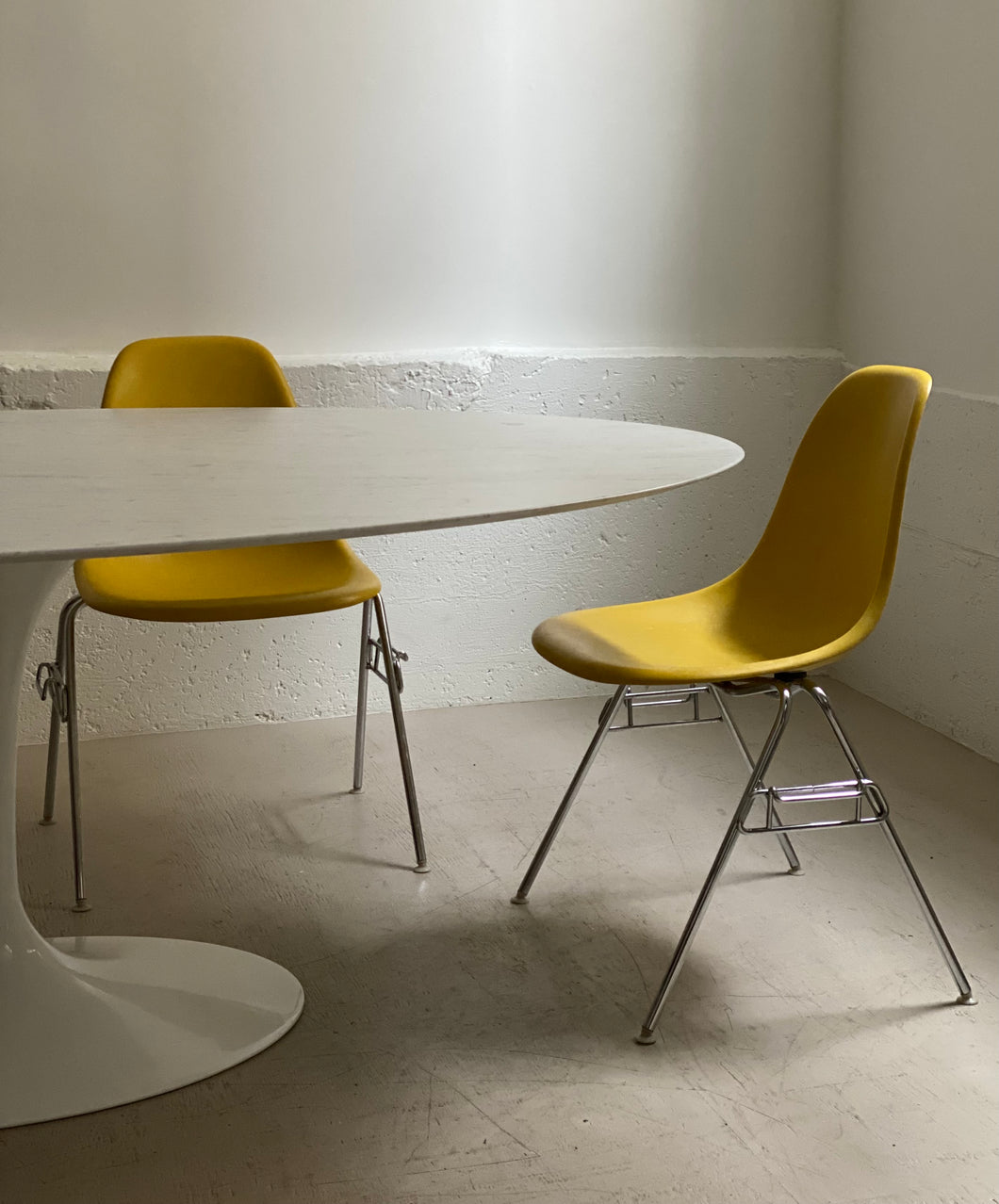 Pair of stacking chairs by Charles & Ray Eames for Herman Miller