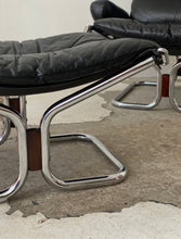 Load image into Gallery viewer, Black leather lounge chair and ottoman by Harald Relling for Westnofa
